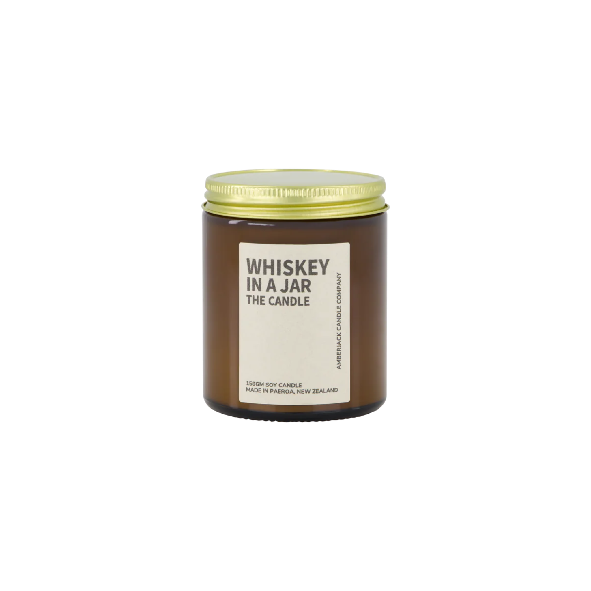 Amber glass jar with brass lid containing whiskey in a jar candle on white background. 