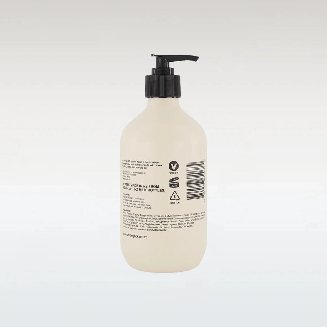 Beige bottle with black pump on a white background
