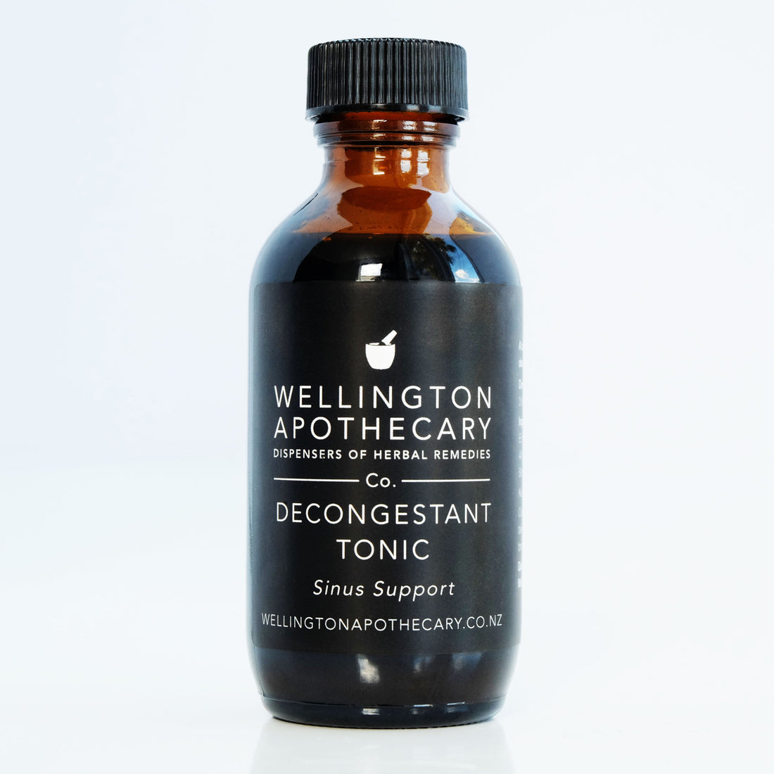 An amber glass bottle of Decongestant Tonic for sinus support. 