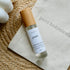 Clear glass roll on vial with bamboo lid containing &