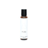 A small amber glass bottle of Fire aromatherapy blend on bright white background. 