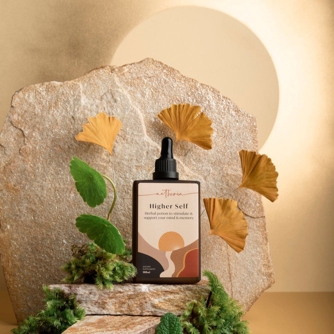 A bottle of Higher Self tonic displayed with some of its plant ingredients. 