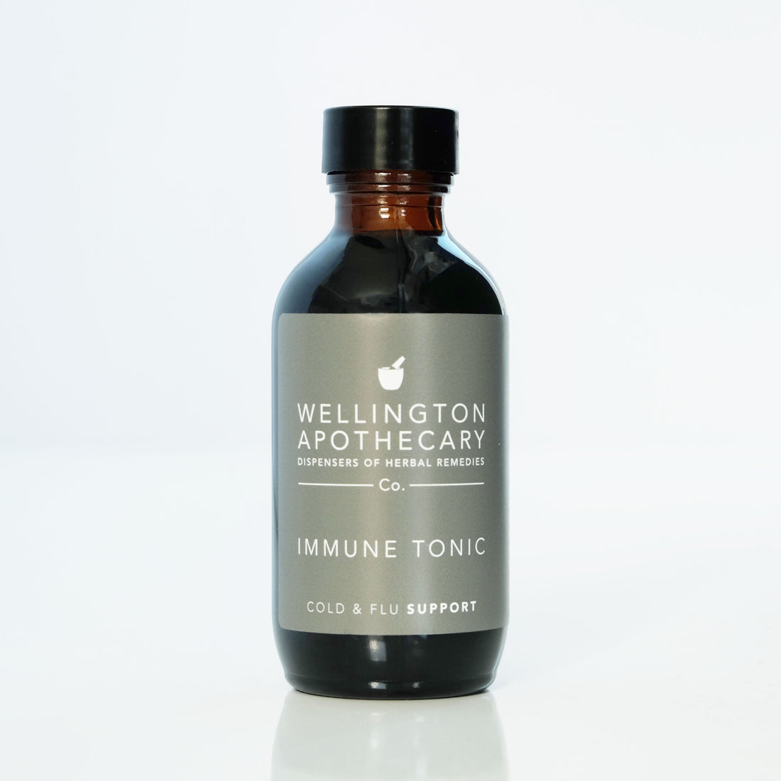 An amber glass bottle of Immune Tonic for cold and flu support. 