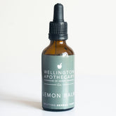 An amber glass dropper bottle of Lemon Balm tonic.