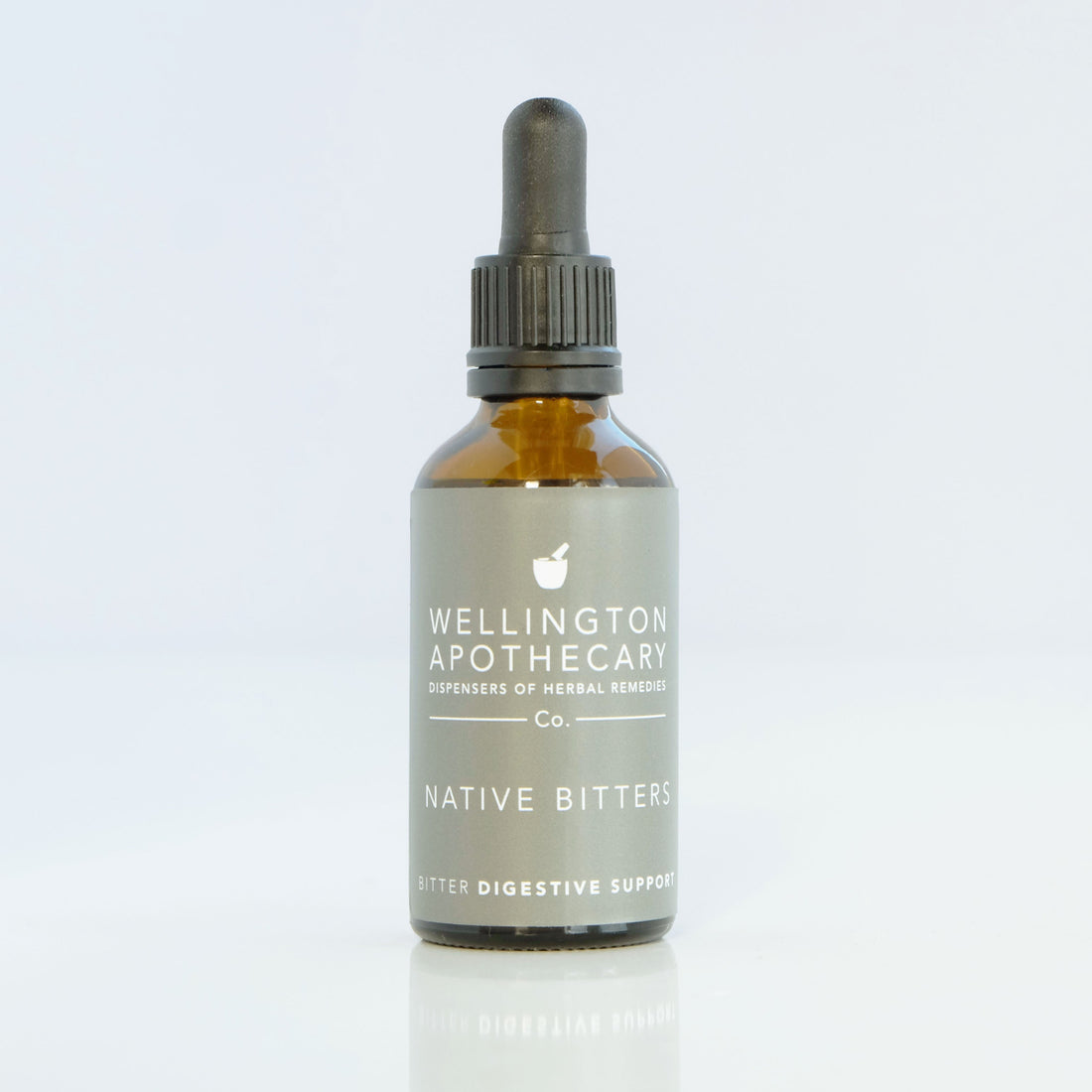 An amber glass dropper bottle of Native Bitters, a bitter tonic to stimulate digestion. 