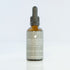 An amber glass dropper bottle of Native Bitters, a bitter tonic to stimulate digestion. 