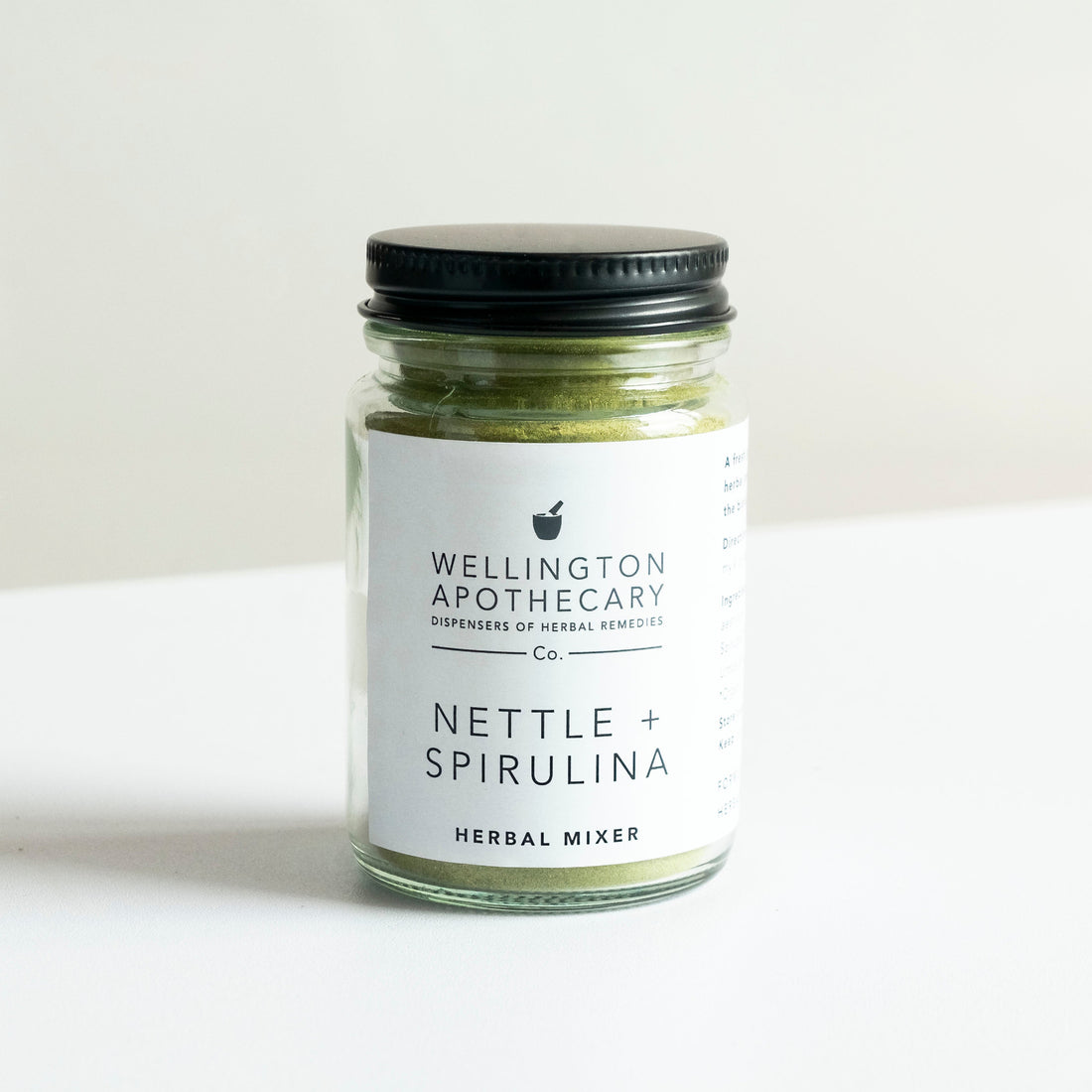 A glass jar of Nettle and Spirulina herbal mixer.