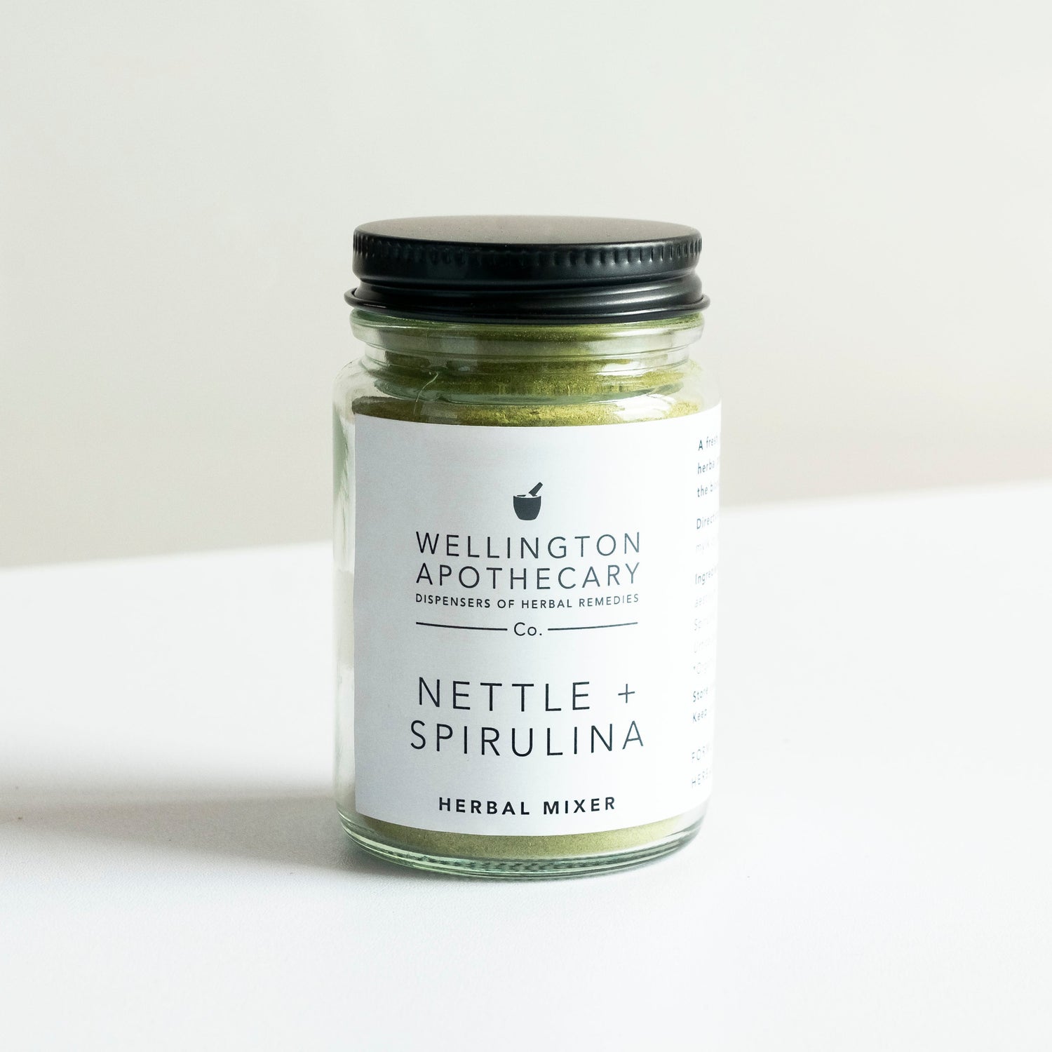 A glass jar of Nettle and Spirulina herbal mixer.