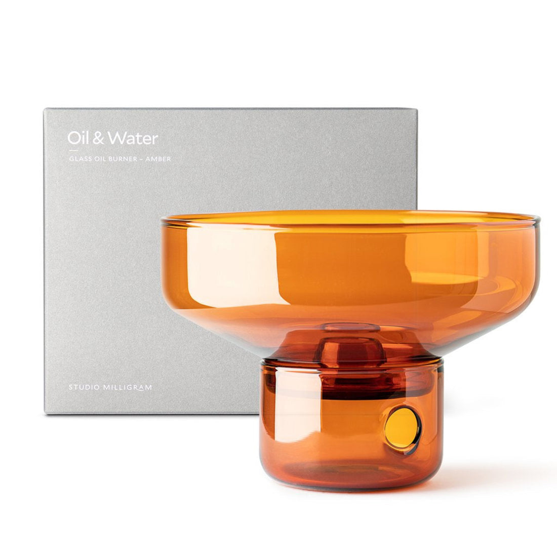 An amber glass oil burner by Studio Milligram. 