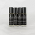 Four glass bottles with black labels containing our perfume oil blends. 