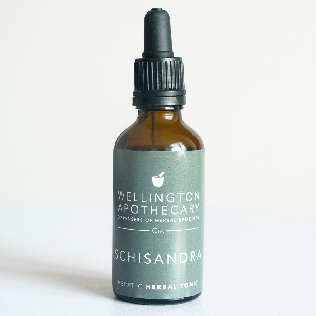 An amber glass 50mL bottle of Schisandra herbal tonic. 