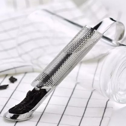 A cylindrical stainless steel tea infuser. 