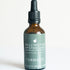 An amber glass dropper bottle of Turmeric herbal tonic. 